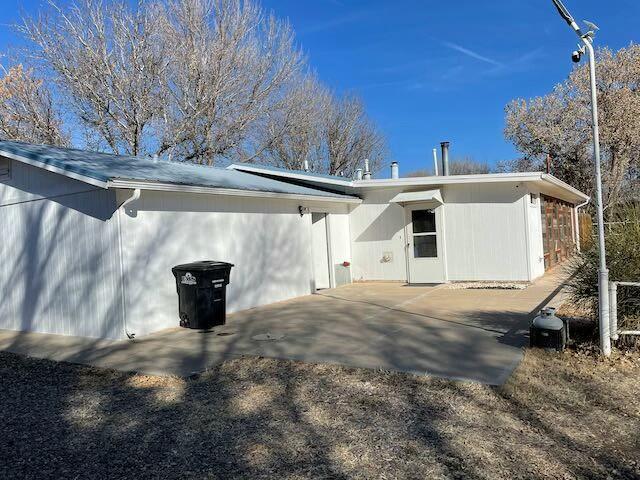 back of property featuring a patio area