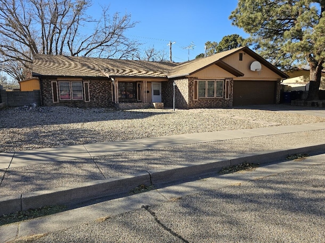 single story home with a garage