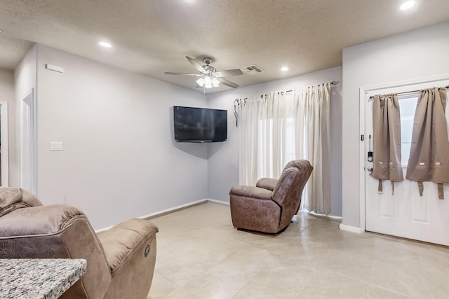 living room featuring ceiling fan