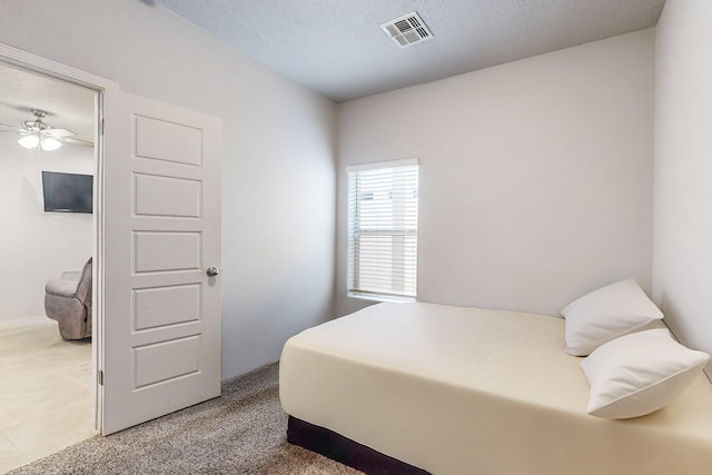 bedroom featuring ceiling fan and carpet floors