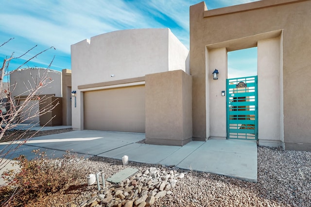 southwest-style home with a garage