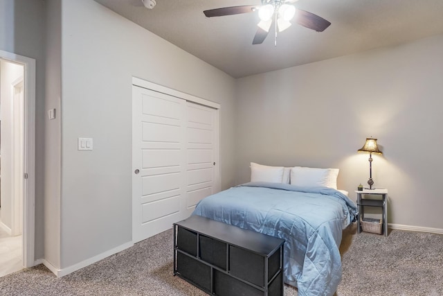 bedroom featuring carpet flooring, ceiling fan, and a closet