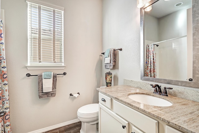 full bath with curtained shower, toilet, vanity, wood finished floors, and baseboards