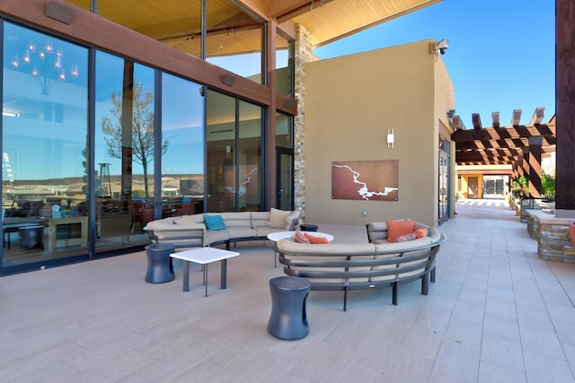 view of patio featuring an outdoor living space and a pergola