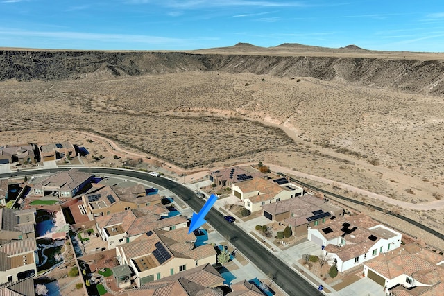 aerial view with a mountain view, a desert view, and a residential view