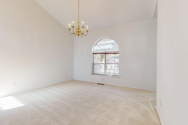 unfurnished room featuring an inviting chandelier, light carpet, and lofted ceiling