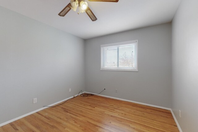 empty room featuring a ceiling fan, light wood-style floors, and baseboards