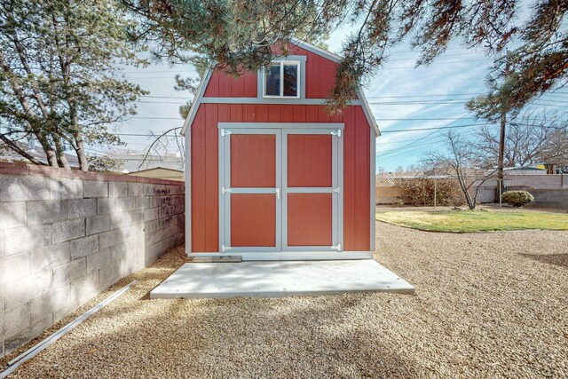 view of shed featuring a fenced backyard