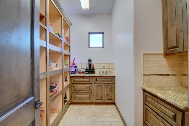 pantry featuring a sink