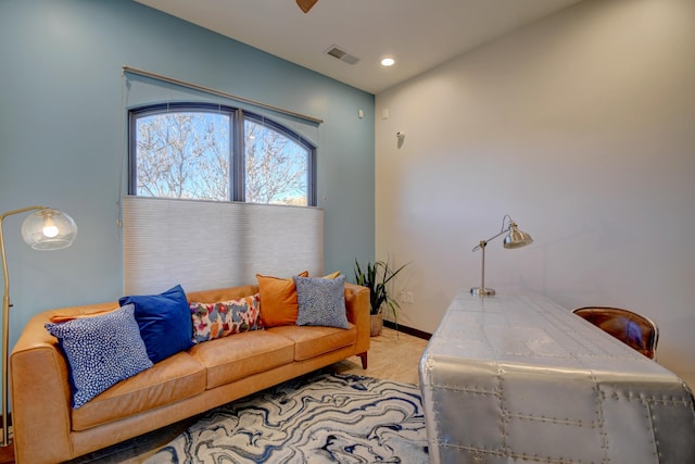 living room with recessed lighting, visible vents, light carpet, and baseboards