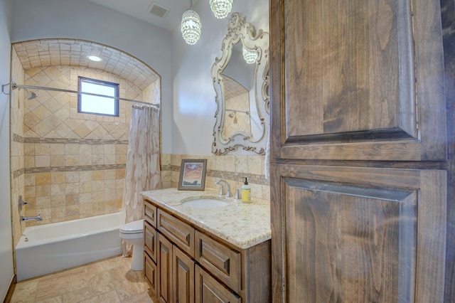 full bathroom with toilet, vanity, visible vents, tile walls, and shower / bath combination with curtain