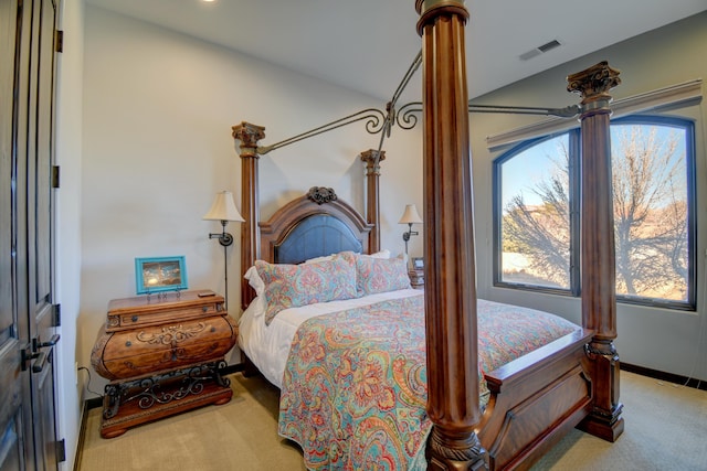 bedroom with baseboards and light colored carpet