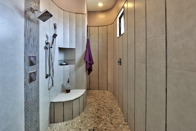 bathroom with a tile shower