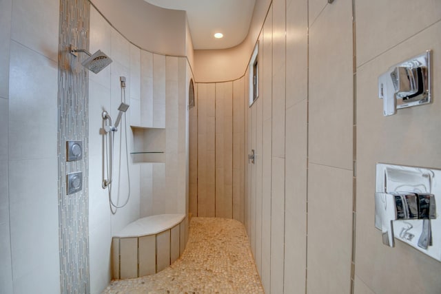 bathroom featuring tiled shower