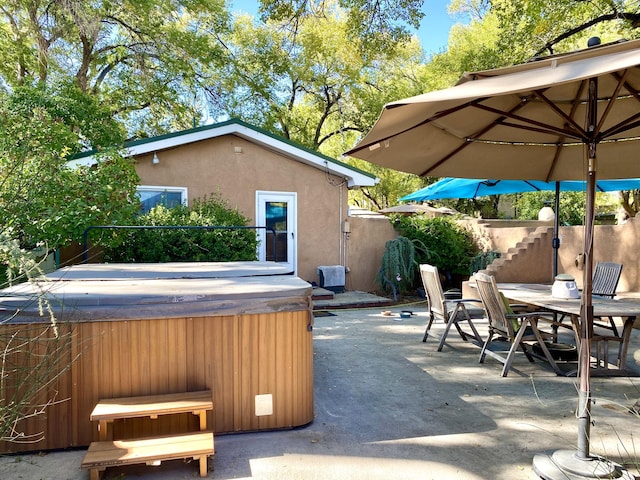 view of patio / terrace featuring a hot tub