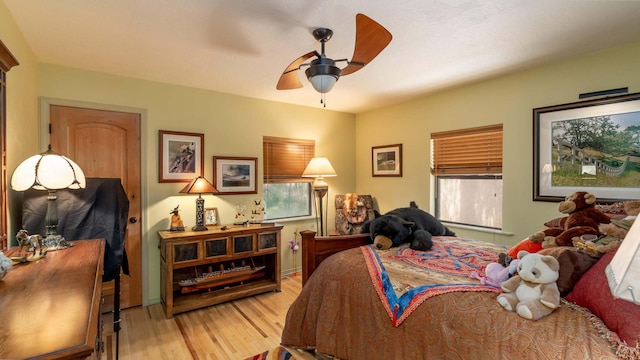 bedroom featuring light wood-type flooring and ceiling fan