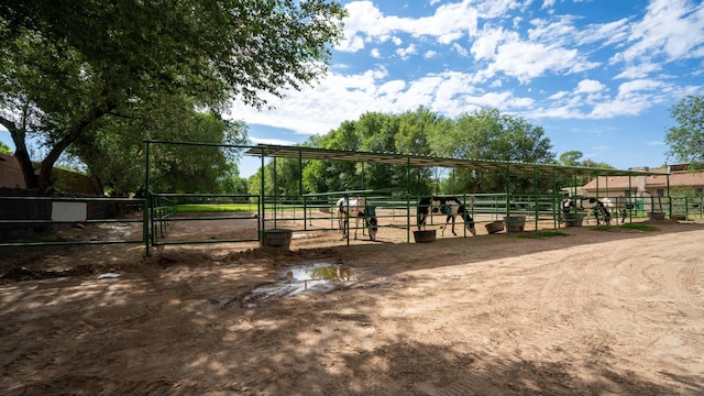 view of property's community featuring an outbuilding and a rural view