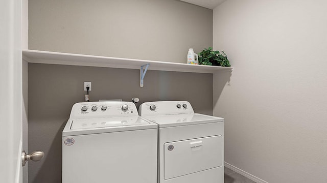 laundry area featuring washing machine and clothes dryer