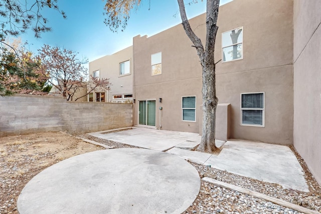 back of property featuring a patio area