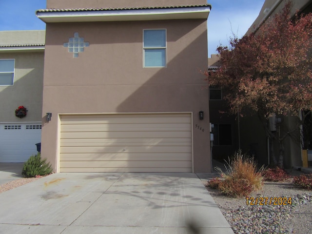 view of property exterior with a garage