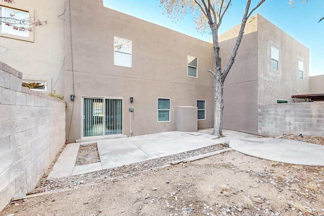 rear view of property featuring a patio area