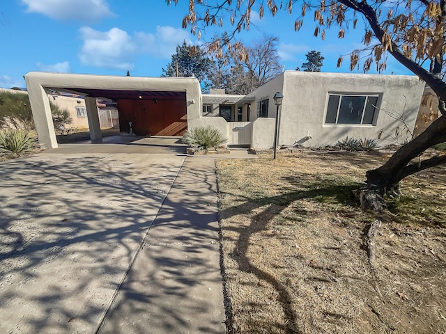 southwest-style home featuring a carport