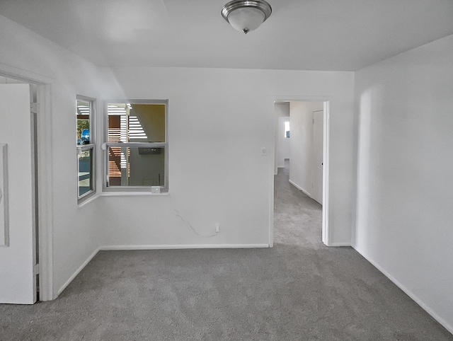 empty room with carpet flooring