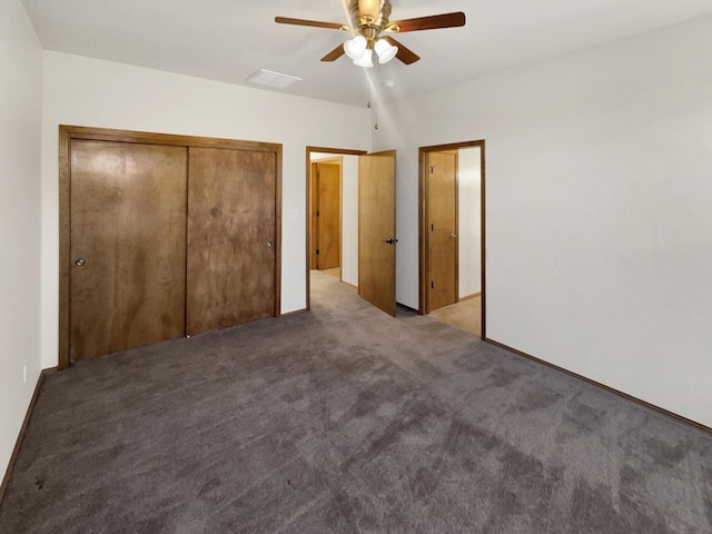 unfurnished bedroom featuring ceiling fan, carpet floors, and a closet