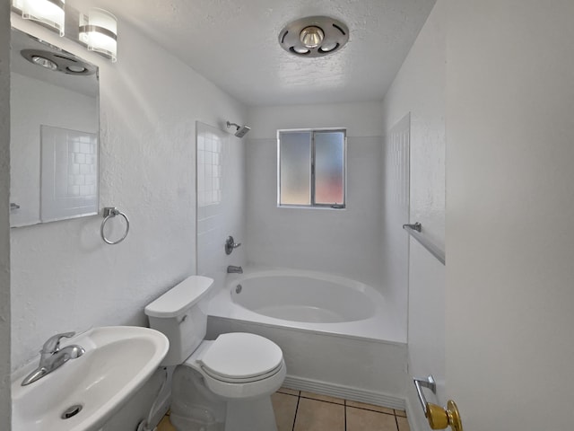 full bathroom with sink, tile patterned floors, a textured ceiling, toilet, and shower / washtub combination