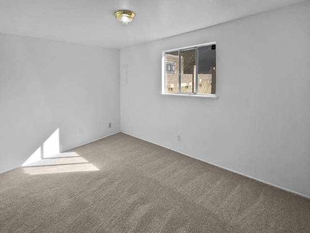 unfurnished room featuring carpet flooring