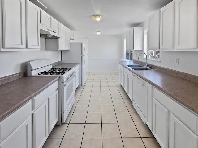 kitchen with white cabinetry, white appliances, sink, and light tile patterned floors