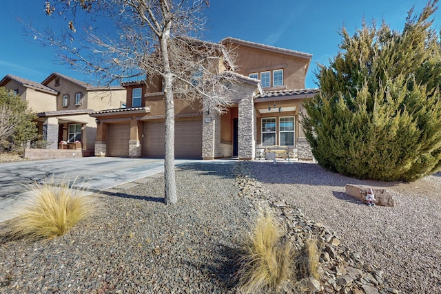 mediterranean / spanish-style house featuring a garage