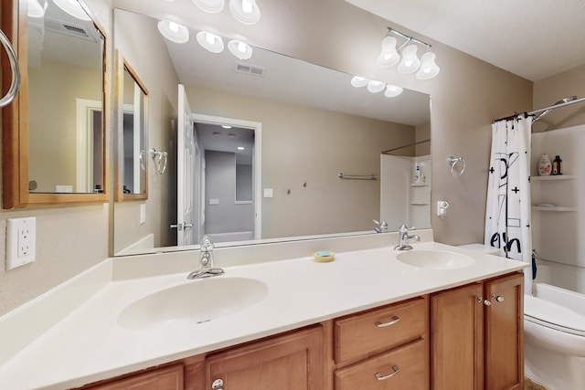 full bathroom featuring vanity, toilet, and shower / tub combo with curtain