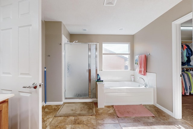 bathroom featuring separate shower and tub, tile patterned floors, and vanity