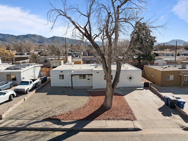 view of front of home featuring a mountain view