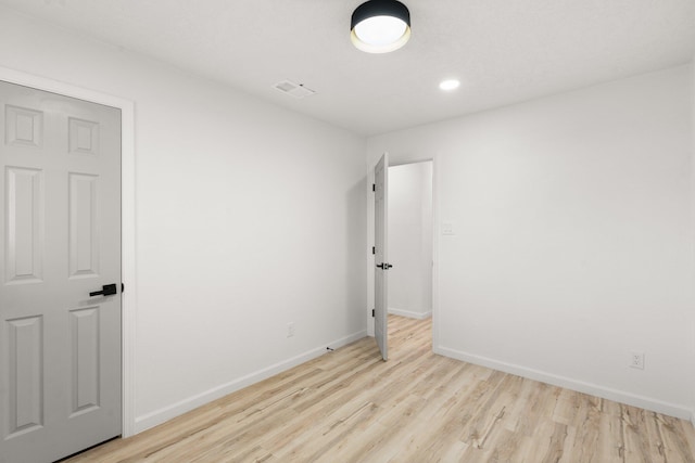 unfurnished bedroom with light wood-type flooring