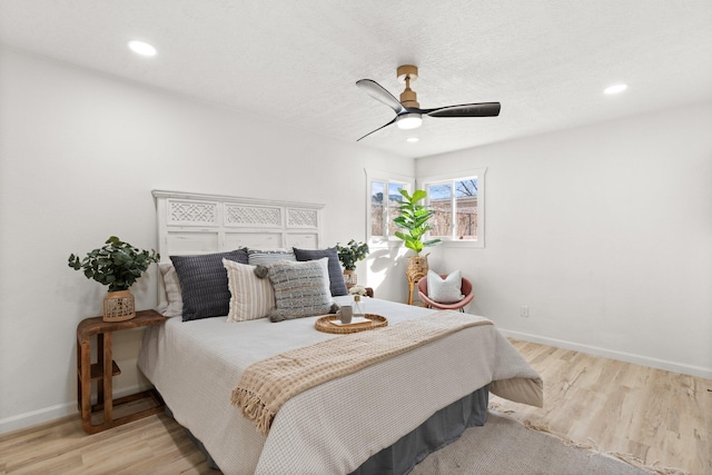 bedroom featuring ceiling fan and light wood-type flooring