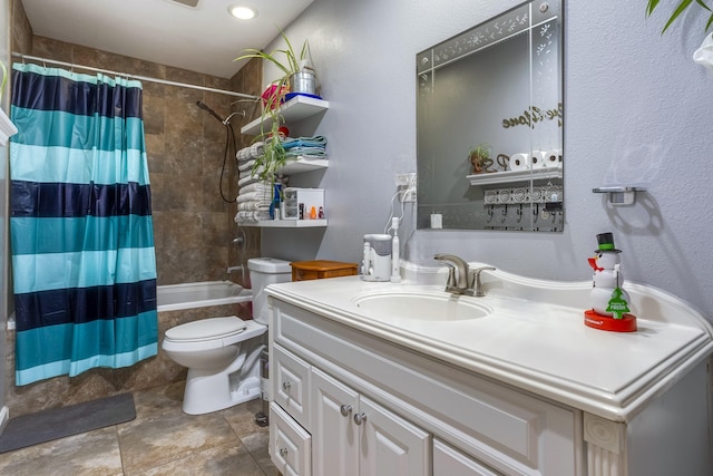 full bath featuring tiled shower / bath combo, vanity, and toilet