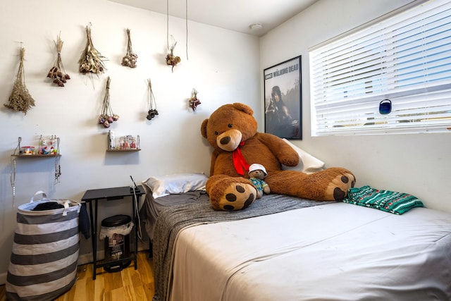 bedroom with wood finished floors