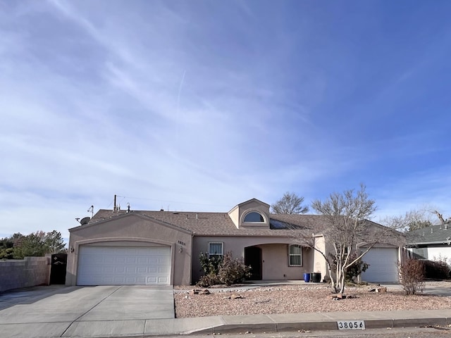 single story home featuring a garage