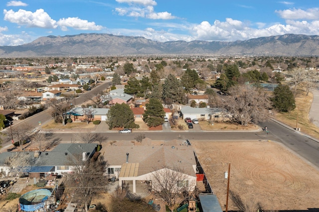 drone / aerial view featuring a residential view and a mountain view