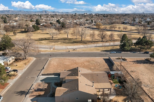 birds eye view of property with a mountain view