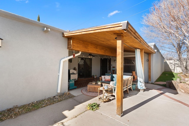 view of patio / terrace with ceiling fan and an outdoor hangout area