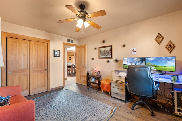 office space featuring ceiling fan and hardwood / wood-style floors