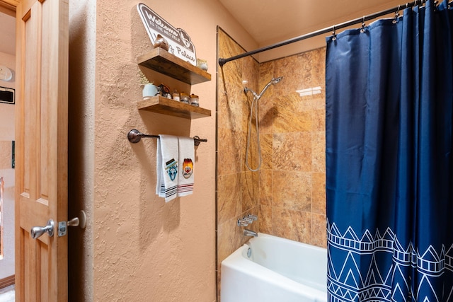 bathroom with shower / bath combination with curtain