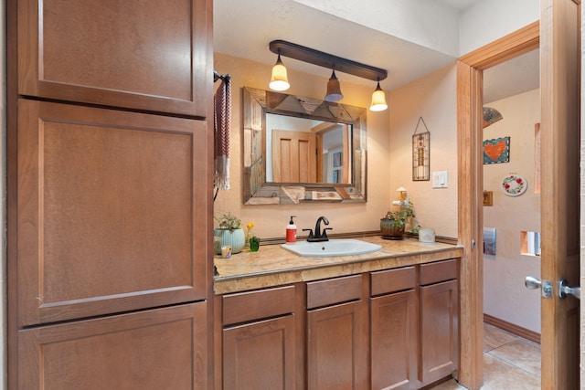 bathroom featuring tile patterned flooring and vanity