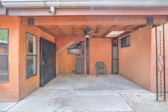 exterior space featuring ceiling fan