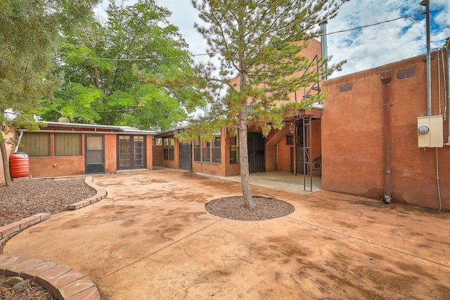 view of patio / terrace featuring a sunroom