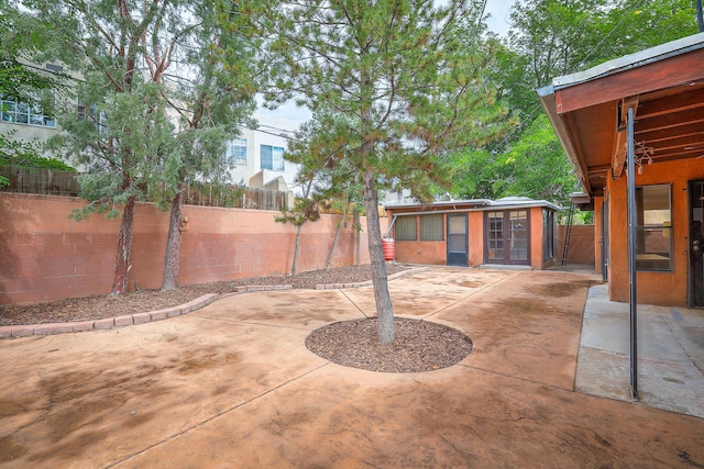 view of patio featuring an outbuilding