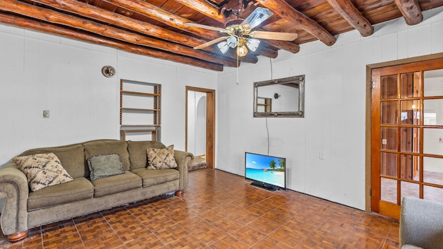 living room featuring beamed ceiling, ceiling fan, dark parquet flooring, and wooden ceiling